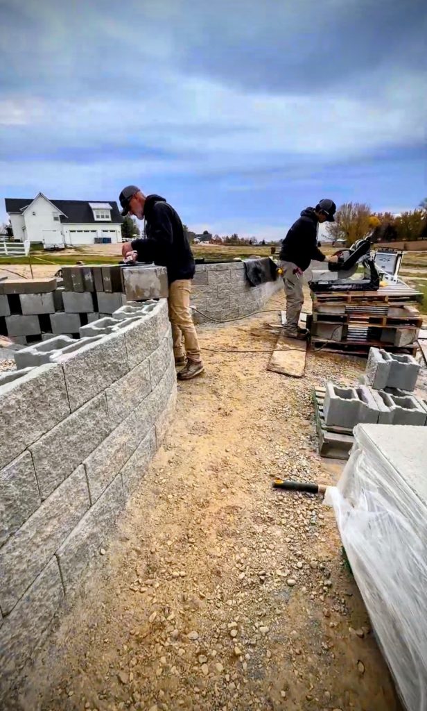 Building the retaining walls that created the foundation for the entire design.